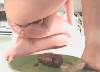 The poop on the plate is being served to a woman