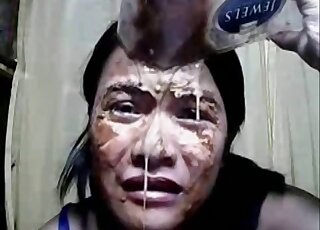 Her face is covered but she wants to eat even more