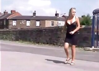 The shaved pussy of a fit blonde is pissing outdoors