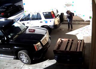 The camera caught the woman behind the car